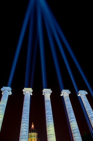 Mizzou columns with lights shining into the sky
