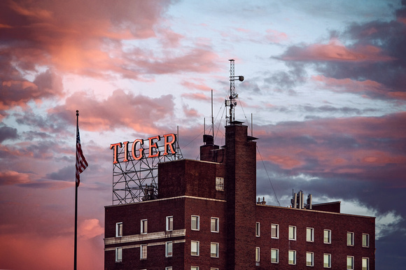 Tiger Hotel neon sign in front of pink and blue missouri sunset