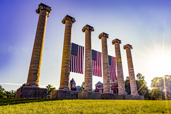 Amercian-Flags-Hanging-Mizzou-Columns-Sunrise